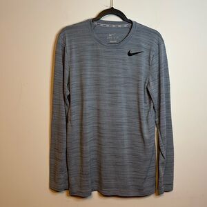 Nike dry fit, gray, athletic shirt, long sleeves with black swoosh size M